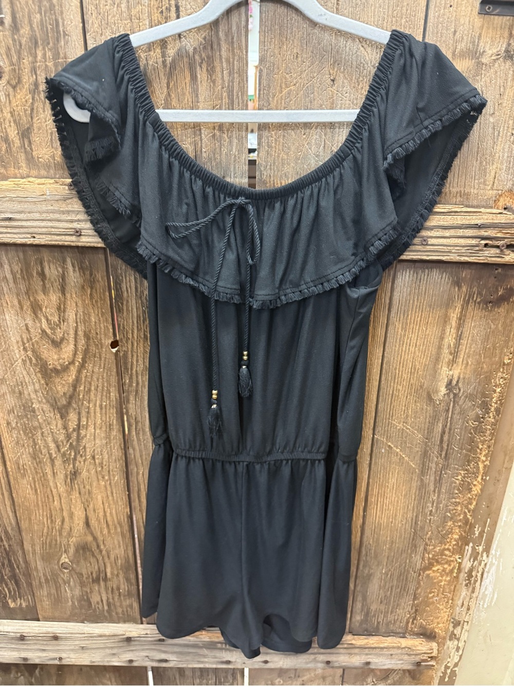 Off-the-Shoulder Black Romper with Ruffle Neckline